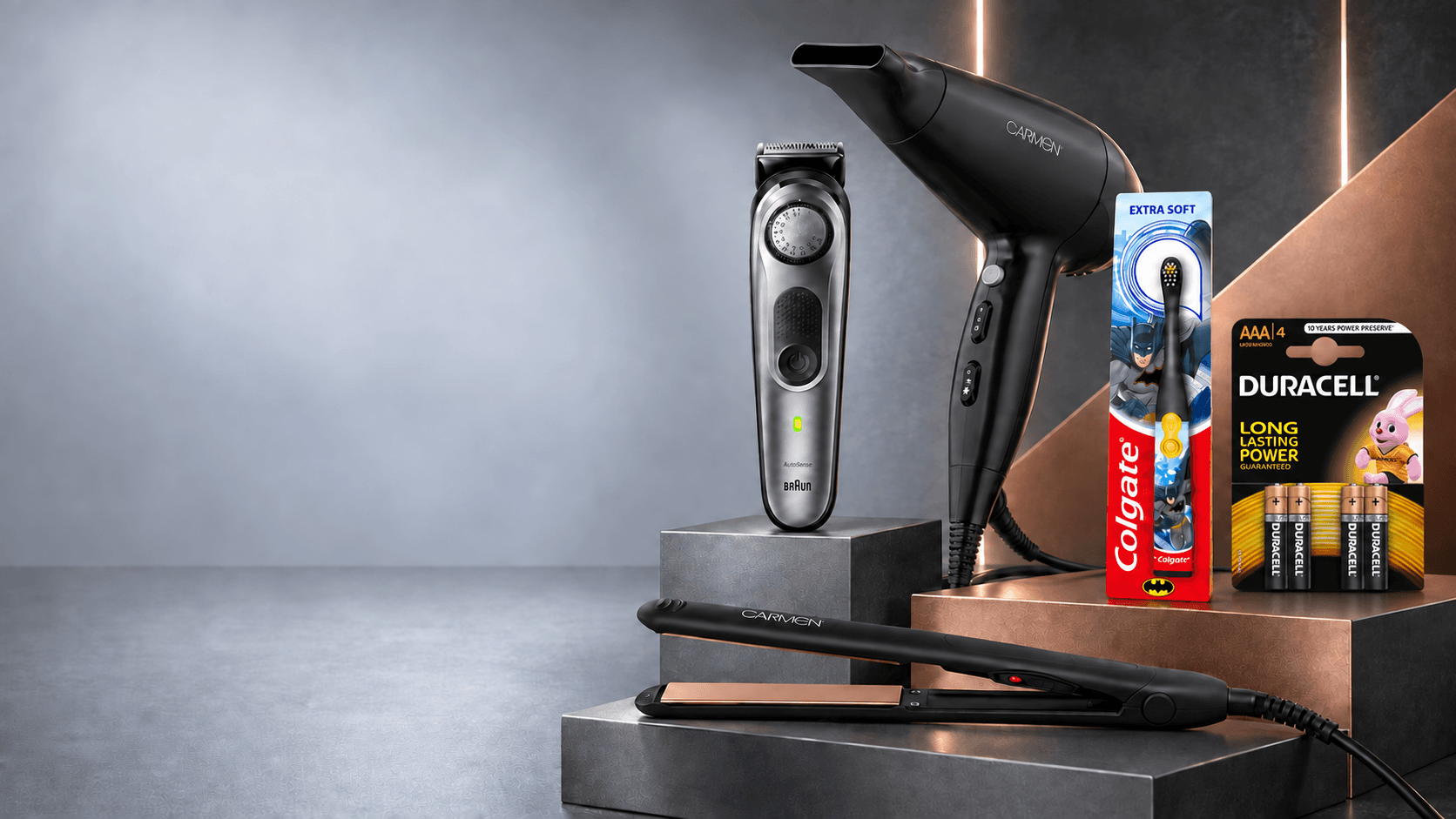 Personal care electrical products arranged on graphite and copper plinths