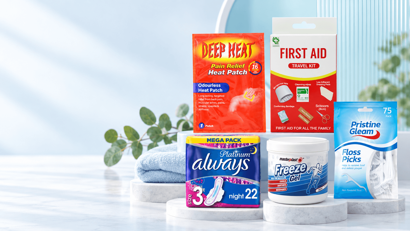 Everyday health and wellness products arranged in a clean blue studio