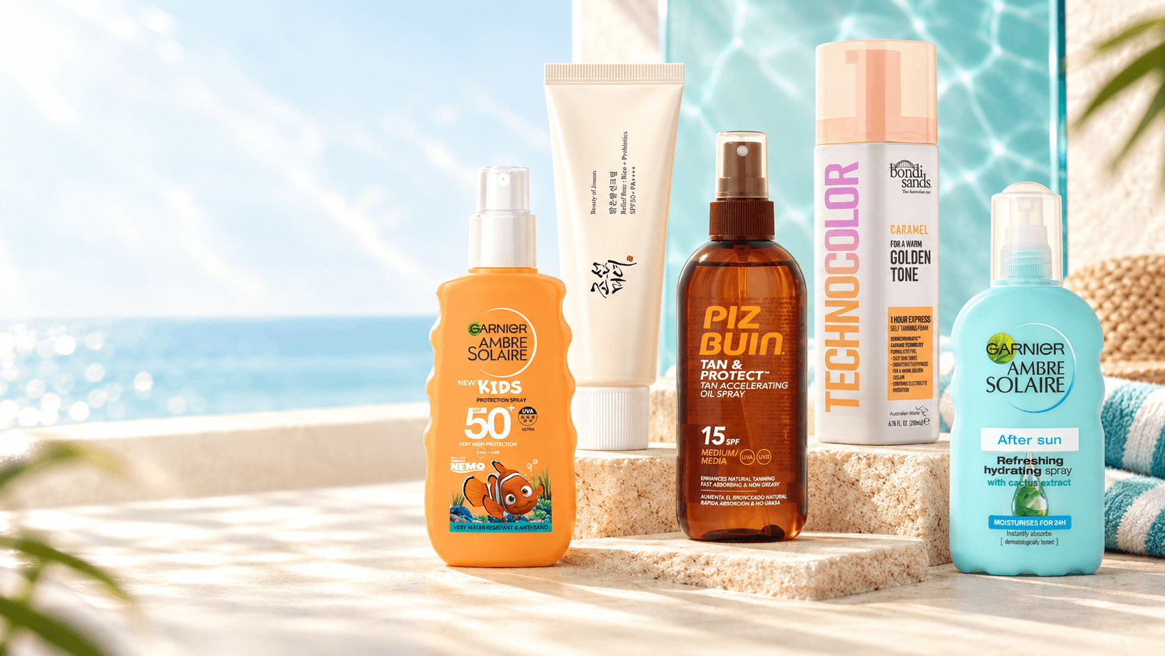 Suncare products arranged in a bright coastal-inspired studio